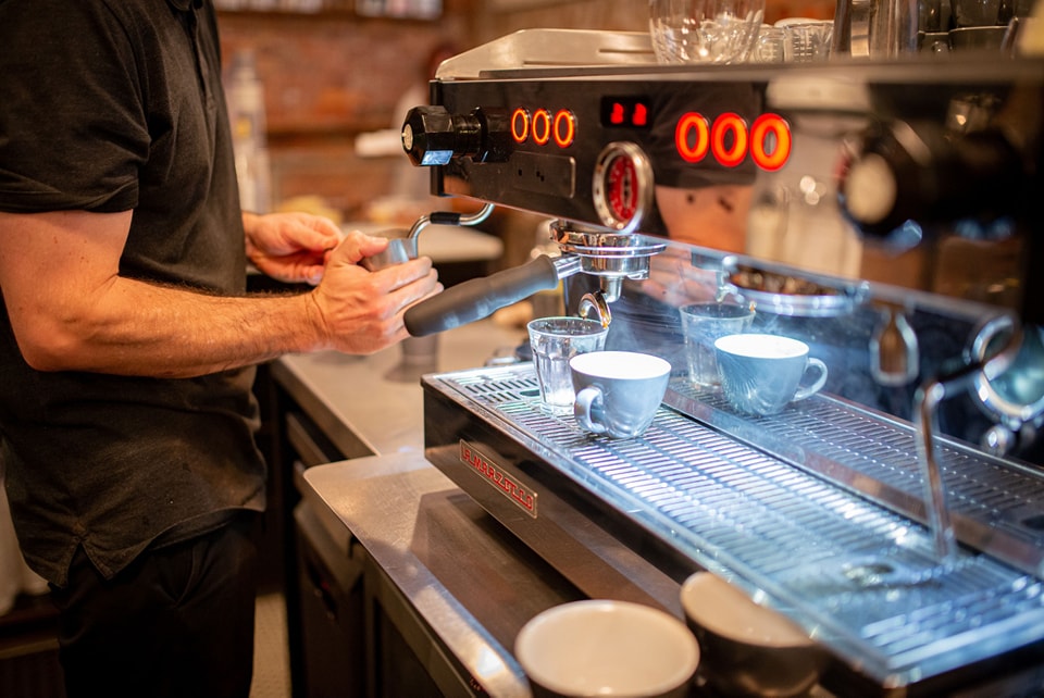 Barista at espresso machine