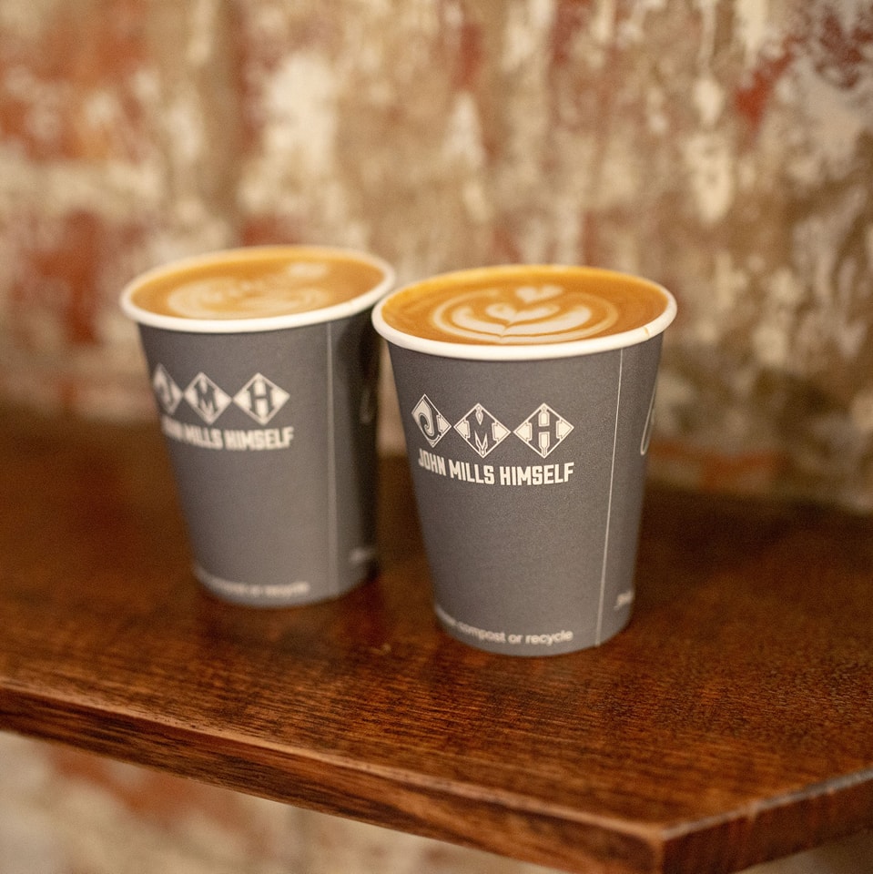 Branded takeaway cups with latte art