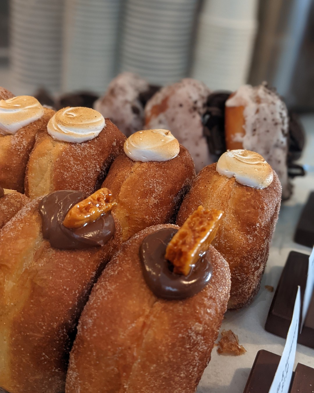Filled doughnuts with meringue and chocolate